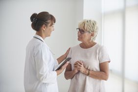Woman talking to doctor