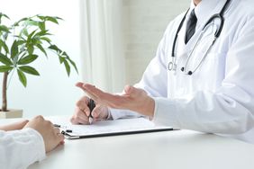 Doctor reviewing test results with patient