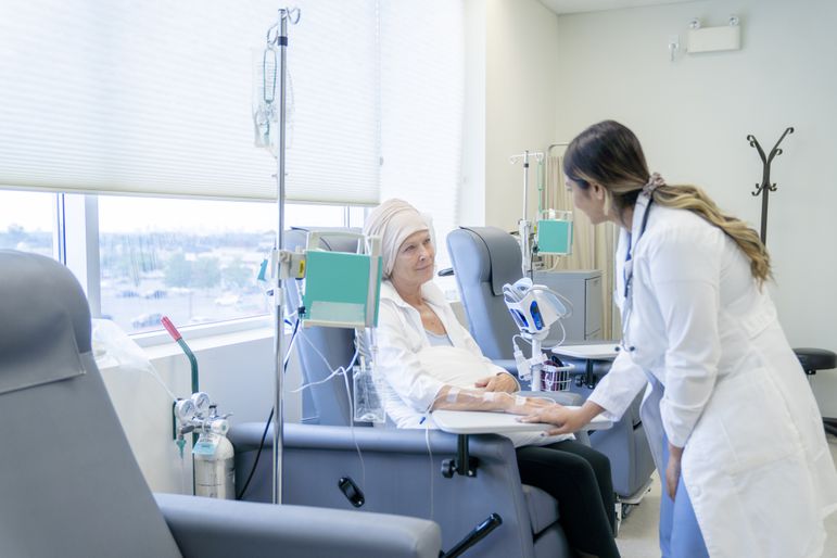 woman with leukemia talking to an oncologist during chemotherapy