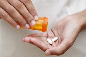 antibiotics-pills-prescription-hands