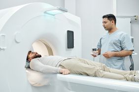 PET scan - doctor helping patient