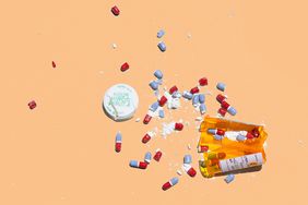 Opioid Use Disorder Symptoms , Bottle of prescription pills smashed on white background